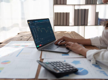 Fund managers consultation about analysis Investment stock market by laptop computer at office. fund, tax, finance concept.